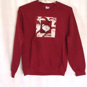 A vintage embroidered Christmas sweatshirt size M